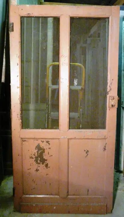 Porte de communication grillagée en bois