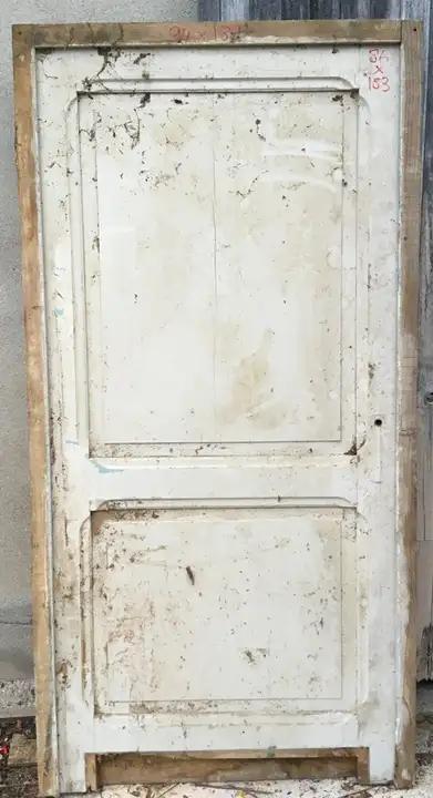Porte de communication et son cadre