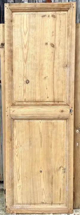 Ancienne porte de communication en bois décapée